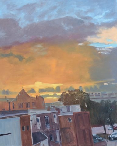 "Shockoe Bottom" Sunset sky with colorful clouds above brick rooftops and distant treeline